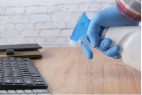 Cleaning a wood tabletop with a soap