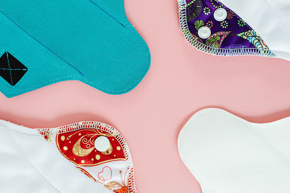  03 image of a variety of different colored reusable sanitary pads