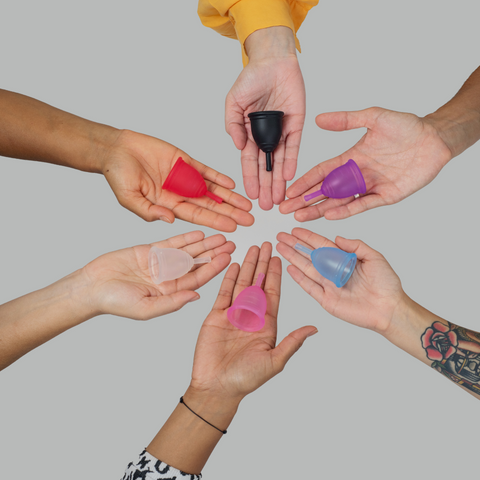 women with their hands out displaying ruby cups