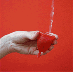 Water being poured into a menstrual cup