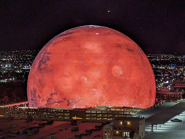 An image of the Sphere in Las Vegas lit up to look like Mars