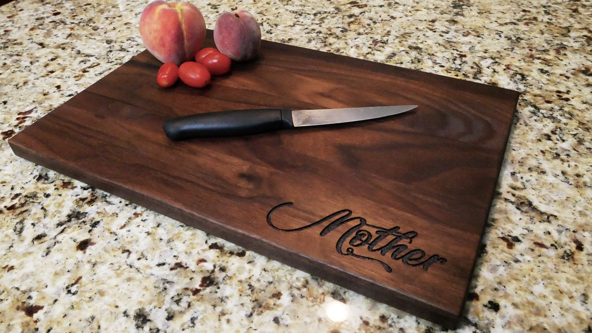 https://cdn.shopify.com/s/files/1/0147/5490/6198/products/mother-custom-engraved-walnut-cutting-board-11-x-16-960425.jpg?v=1628785702