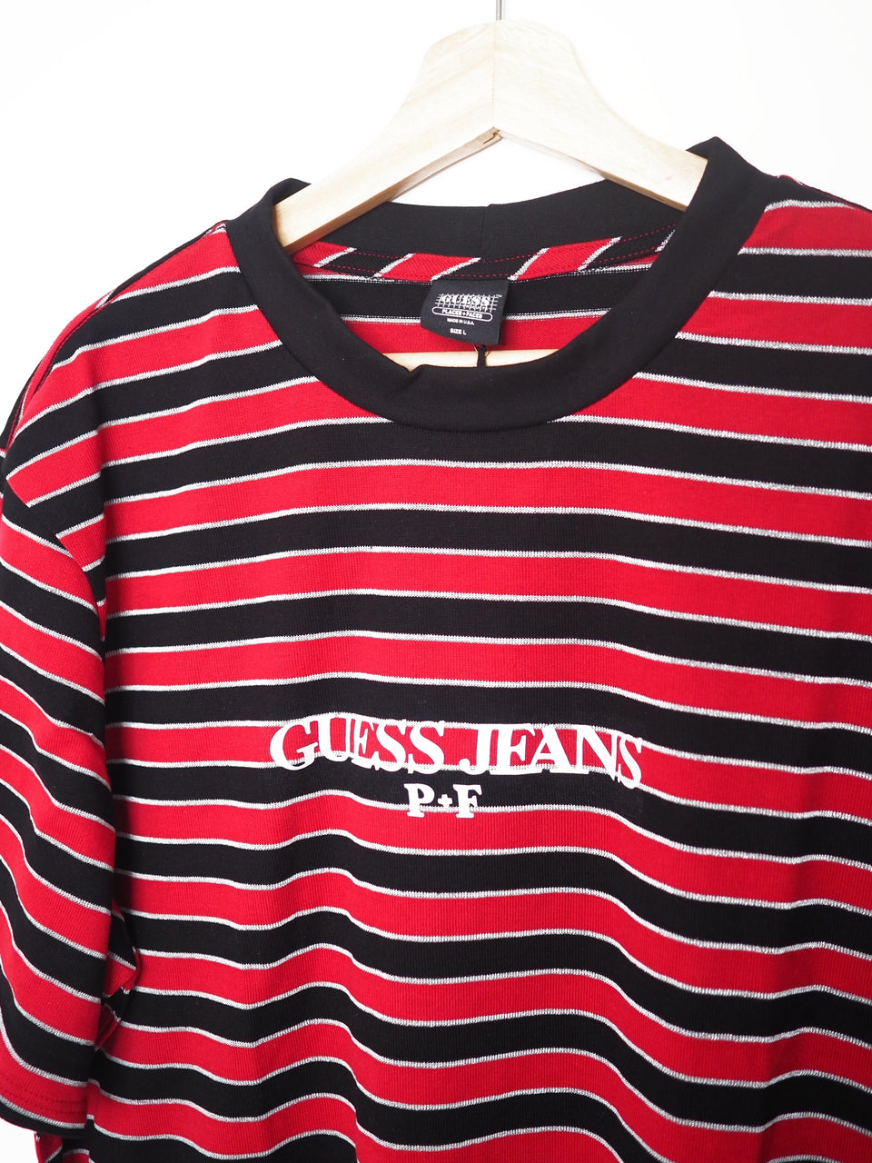 red and black guess shirt