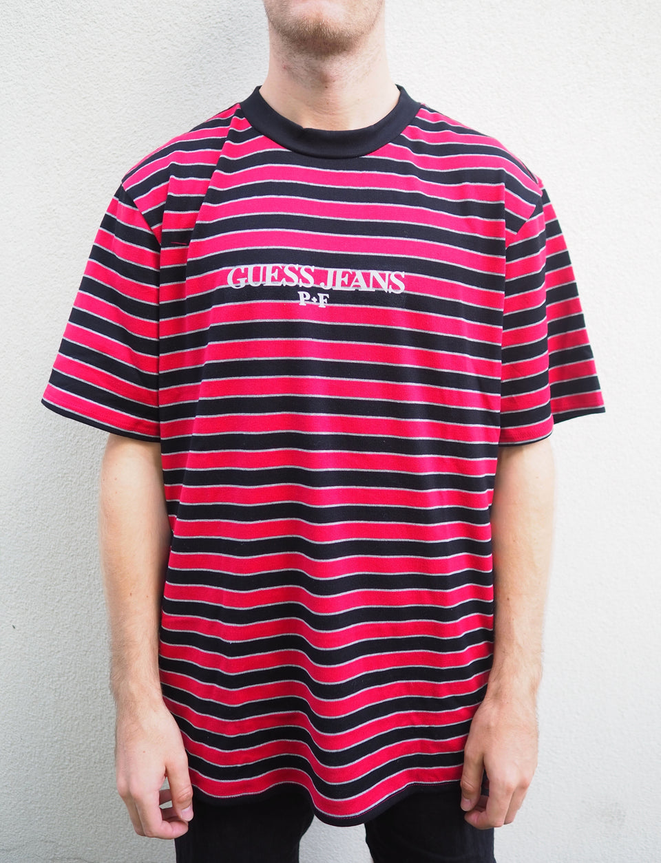 red and black guess shirt