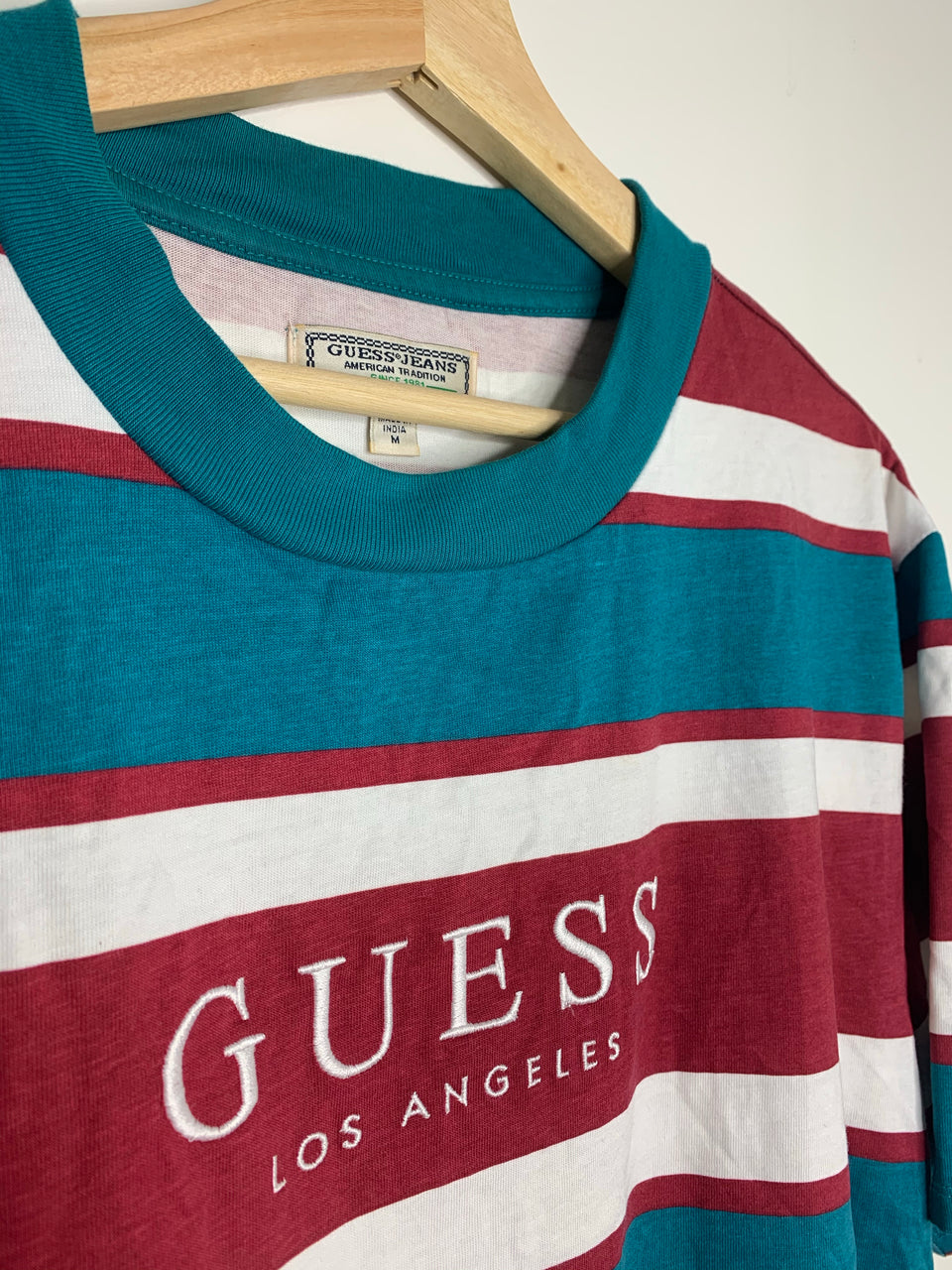 red and white striped guess shirt