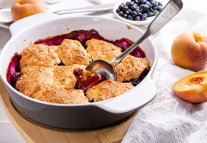 Rustic cobbler with peaches and blueberries.