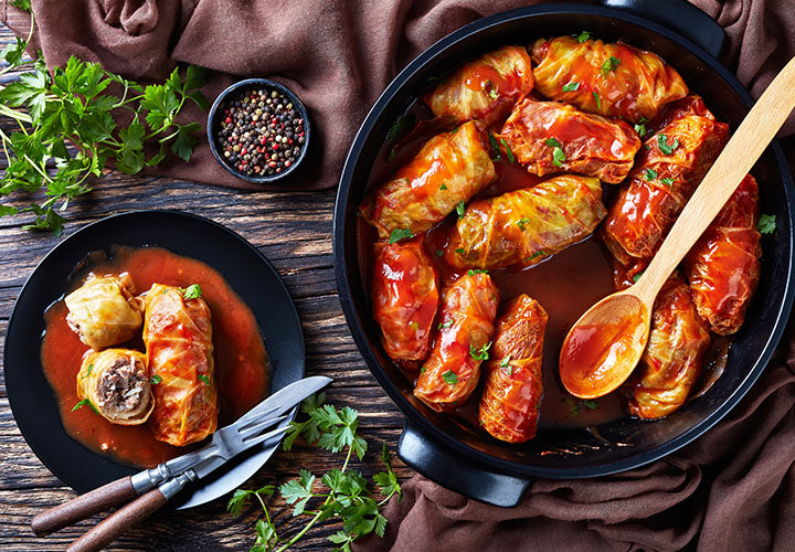 Yummy cabbage rolls in a paprika-spiced red sauce in a pan