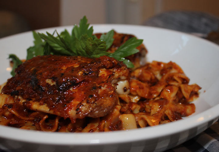 Chicken paprikash made with Hungarian sweet paprika over egg noodles