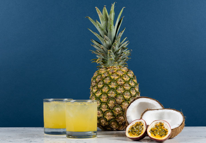 Delicious fruit punch recipe with pineapple, passion fruit, and coconut extract.