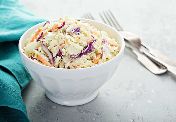 Coleslaw with mayo, cabbage, carrots, onions, and spices