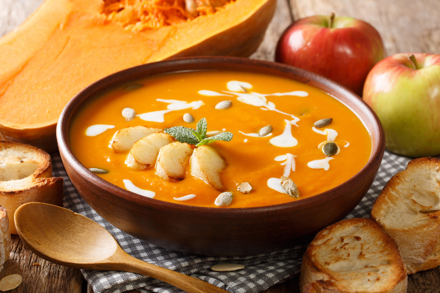 Cozy fall soup made with pumpkins, apples, and seasoned with ginger spice.