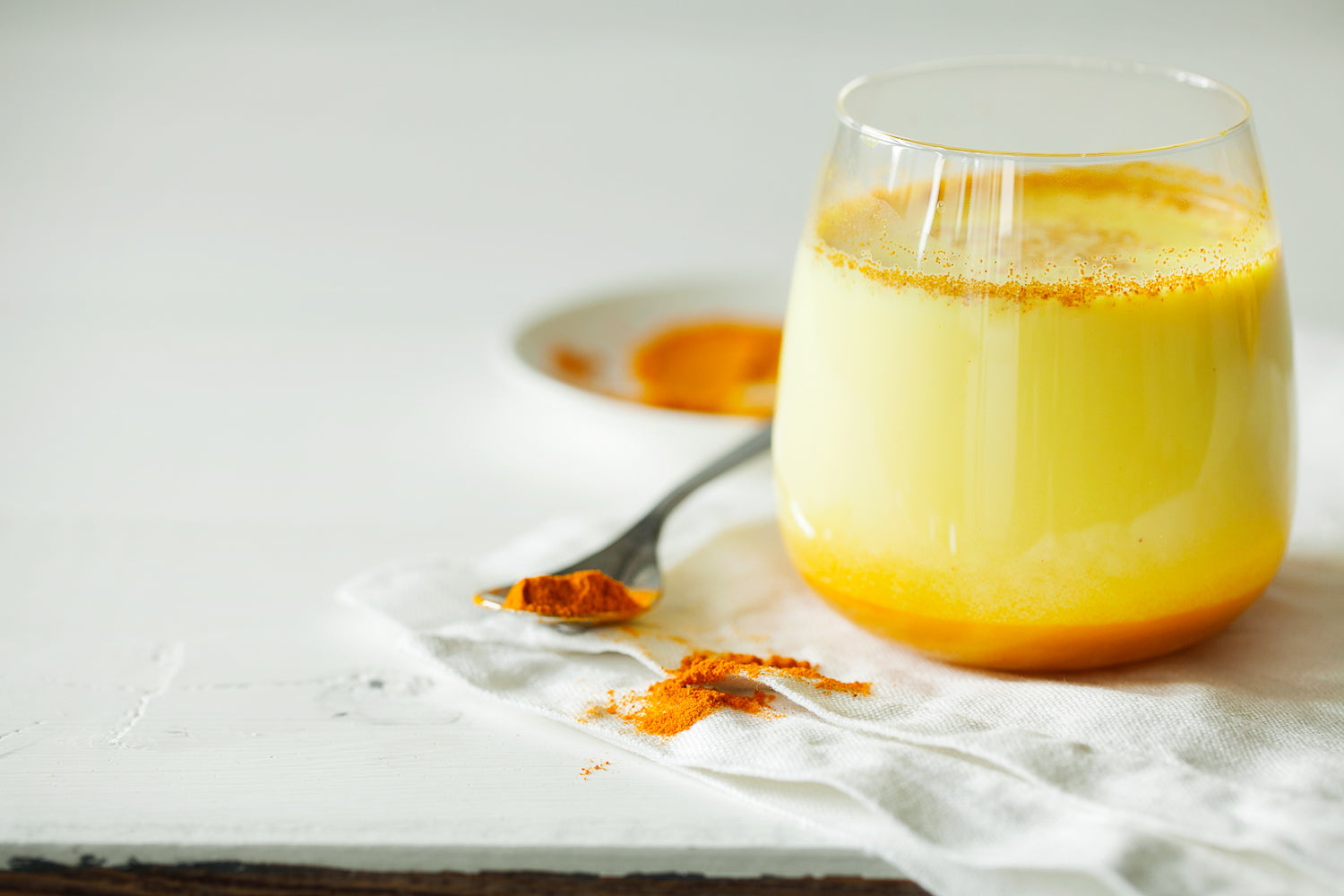 Turmeric latte aka golden milk made with gourmet turmeric spice and honey.