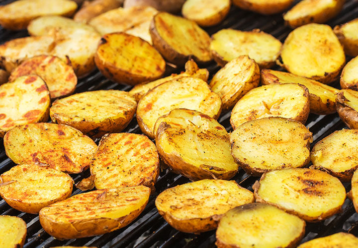 Grilling small gold potatoes for a potato salad with shallots and scallion.