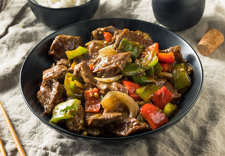 Sichuan style beef stir fry with peppers and seasoned with ginger spice.