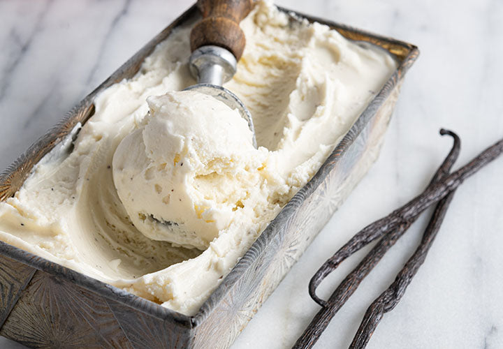 Creamy ice cream in a bowl with real vanilla beans.