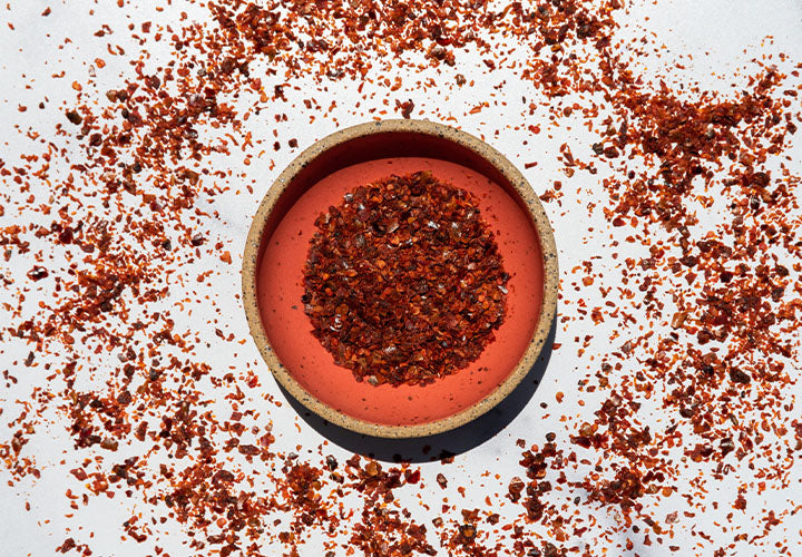 Aleppo pepper flakes in a small dish