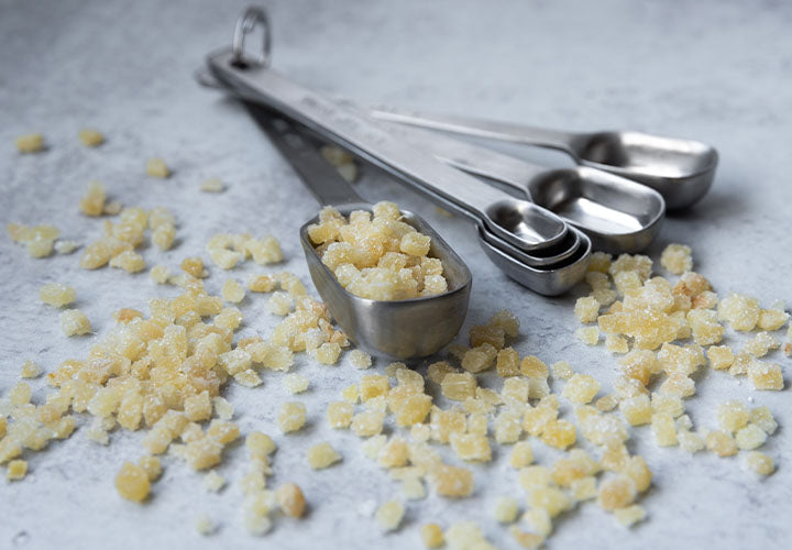 Crystalized candied ginger pieces ready for use in baking and desserts.