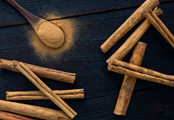 Cinnamon sticks and ground cinnamon being checked for freshness and flavor.