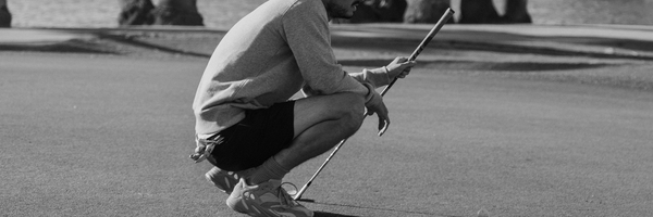 man holding a putter