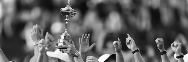 ryder cup trophy being held in celebration