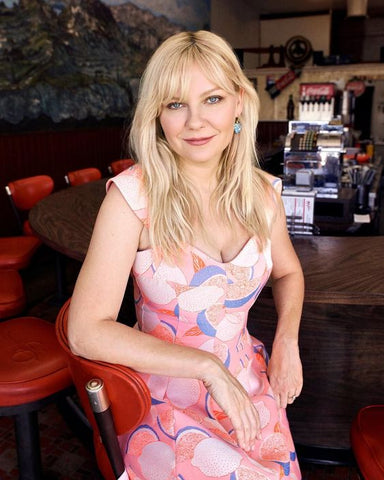 Kirsten Dunst with shaggy haircut and curtain fringe