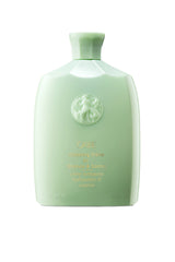 Oribe Cleansing Creme light green bottle with gold text 