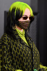Billie Eilish with black hair and neon green roots