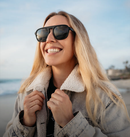 Young woman traveler wearing sunglasses covering face by hand to protect UV  rays from the sun at tropical sandy beach on sunny day, Skin care and eyes  protect concept 8316267 Stock Photo