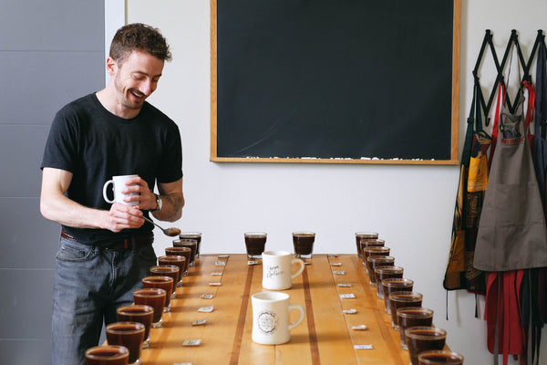 Jake prepping for the Cup Tasters Championship at the Olympia Coffee Cupping Lab