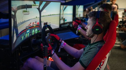 Guy driving a racing simulator