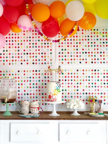 rainbow party backdrop with balloons