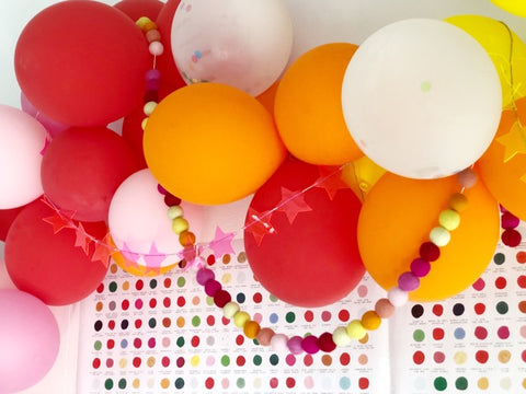 balloon and felt ball garlands for rainbow christmas party