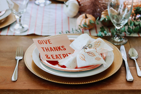place settings with modern cards for friendsgiving