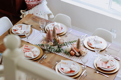 Friendsgiving table settings with paper plates