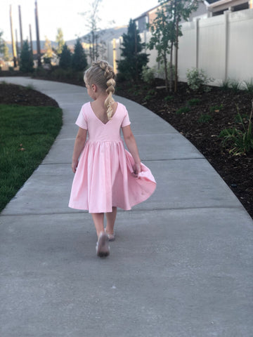 girl with unicorn braid style in pink dress