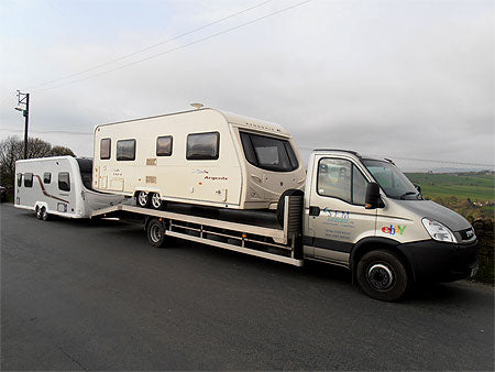 One of our Pickup trucks loaded up with two caravans for delivery