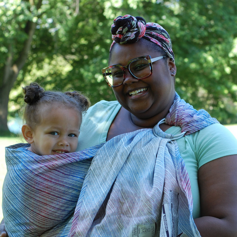 Plus size mama wearing her toddler in a 1.8m standard length linen ring sling