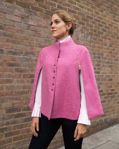 Charity Wakefield, actress from Scoop Netflix and Sense & Sensibility, wearing wool cape by British sustainable fashion brand DEPLOY