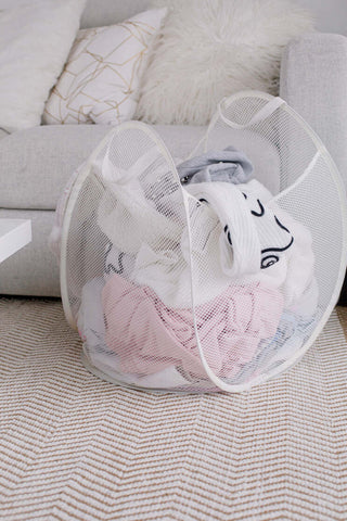 Mesh basket filled with laundry