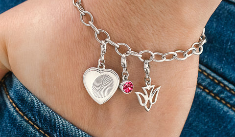 sterling silver fingerprint charm bracelet with heart, swarovski birthstone, and dove charms