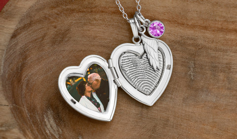 sterling silver heart shaped locket with picture and engraved fingerprint on the inside with angel wing and swarovski birthstone charms