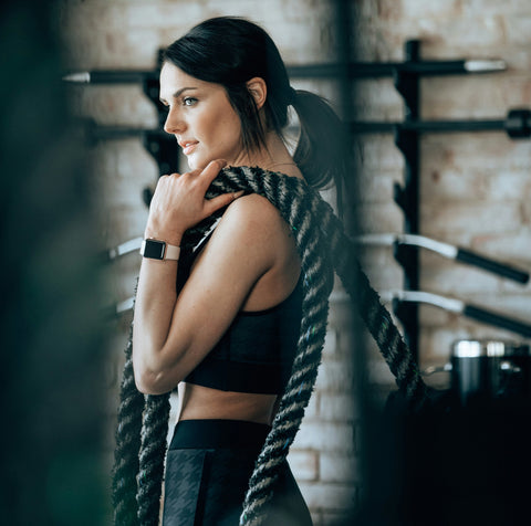 Woman in a gym doing crossfit