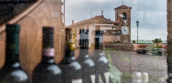 Selective focus shot of wines visible in the window