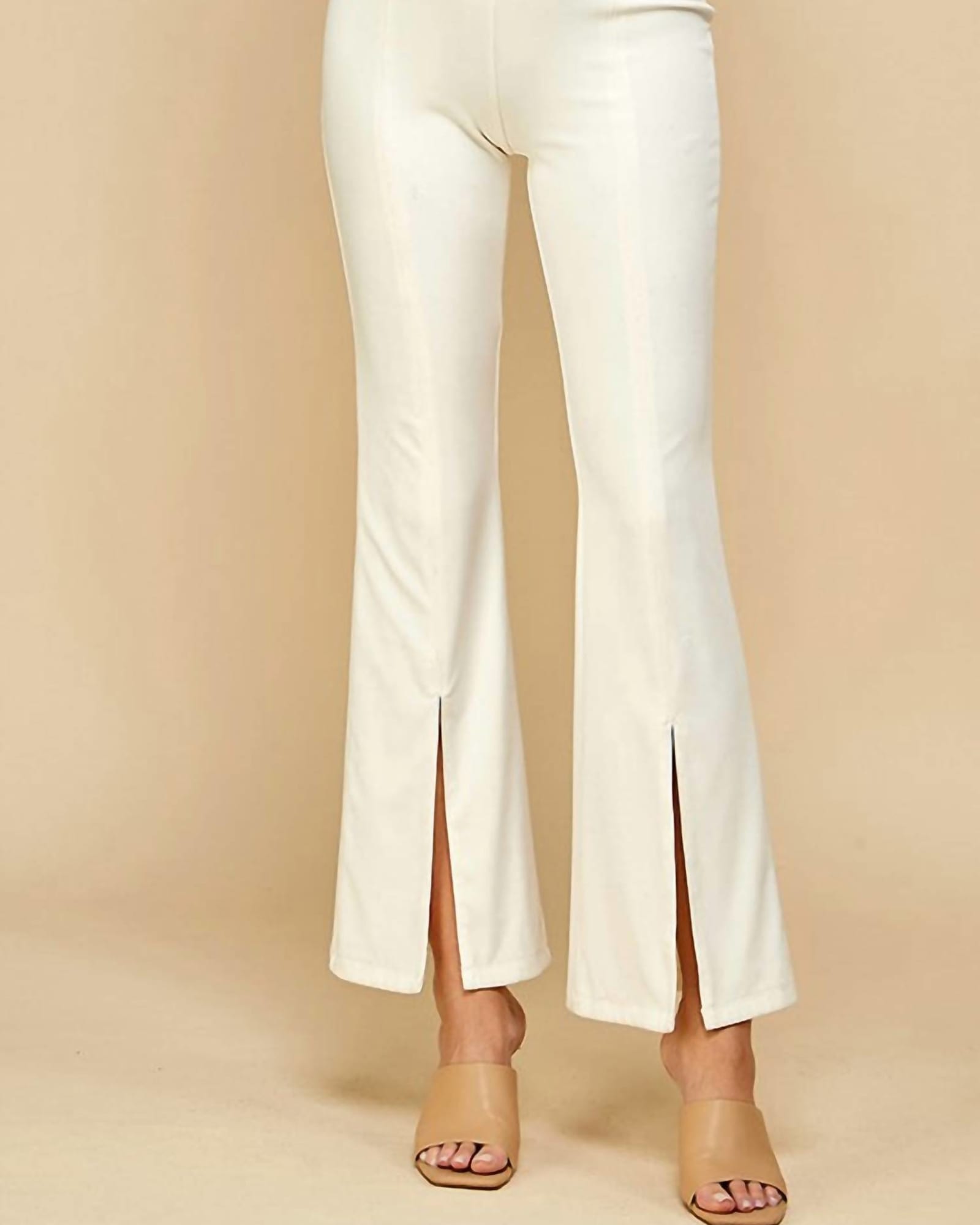 Split The Difference Front Slit Flared Pants In White | White