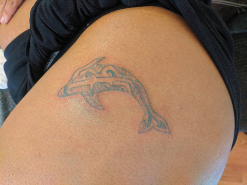 Free hand dolphin tattoo