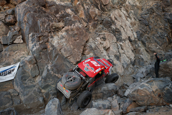 Casey Currie rock climbing in his trophy truck at KOH 2021