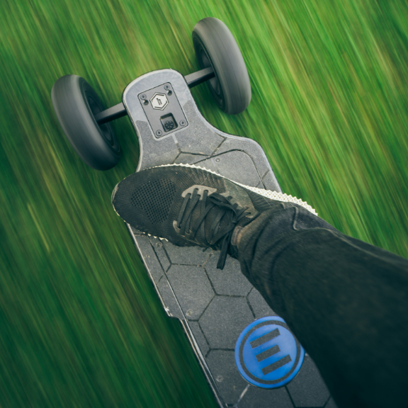 riding an electric skateboard in high speed