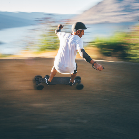 Jeff Anning ridign a fast electric skateboard