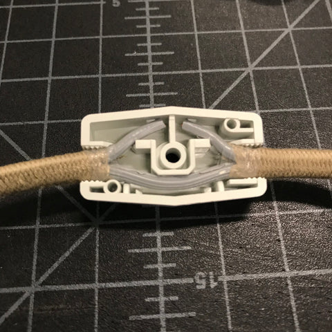 parallel cord with cut hot wire pressed into rotary switch cover