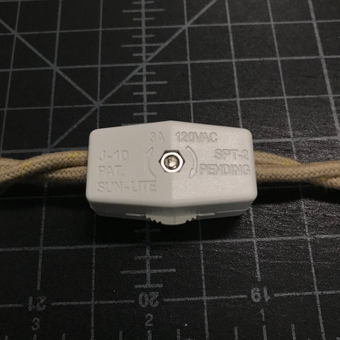 closed rotary switch attached to twisted pair wire